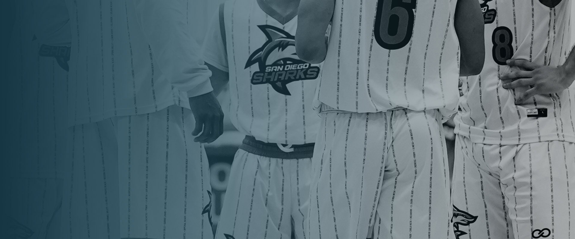 Sharks players side by side in white home uniforms